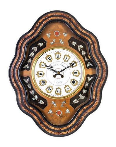 * A Victorian Mother-of-Pearl Inlaid Wall Clock Height 24 1/4 inches.