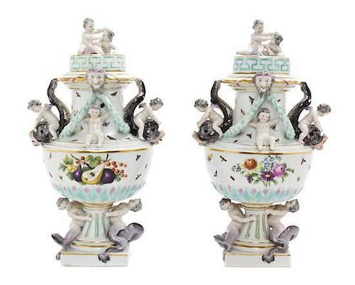 A Pair of Meissen Porcelain Covered Urns Height 11 inches.
