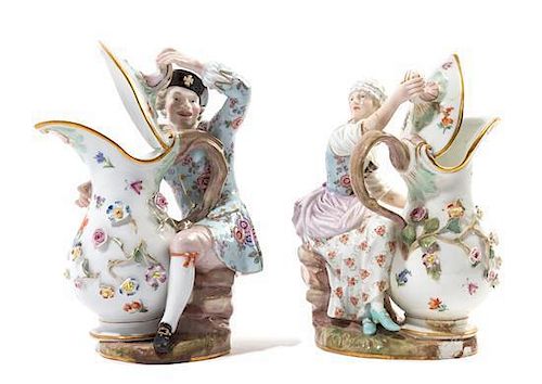 * A Pair of Meissen Porcelain Figural Ewers Height 7 1/4 inches.