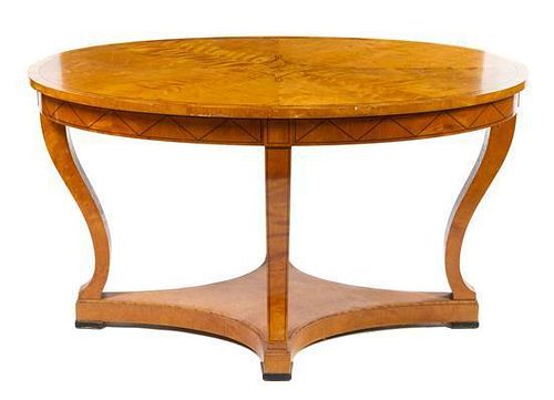 * A Biedermeier Style Birch Center Table Height 29 x width 51 1/2 x depth 33 3/4 inches.