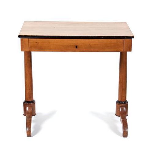 A Biedermeier Partial Ebonized Writing Table Height 29 3/4 x width 31 1/4 x depth 22 inches.
