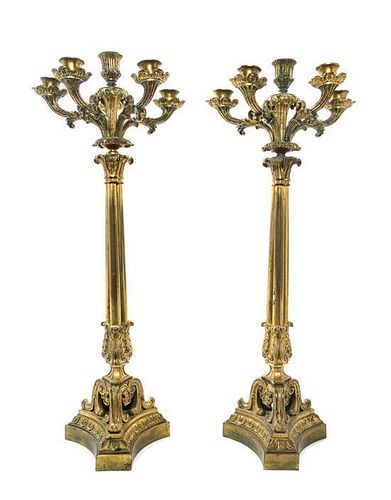 * A Pair of Continental Gilt Bronze Six-Light Candelabra Height 23 1/2 inches.