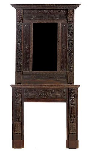 A Renaissance Revival Oak Fireplace and Overmantel Mirror Height overall 117 x width 56 x depth 17 inches.