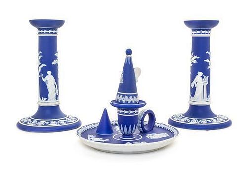 * A Group of Three Wedgwood Blue Jasperware Articles Height of candlesticks 7 3/4 inches.