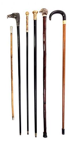 A Collection of Five Victorian Walking Sticks and a Cane Height of tallest 36 1/2 inches.