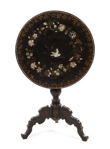 * A Victorian Mother-of-Pearl Inset Lacquered Table Height 26 x diameter 24 inches.