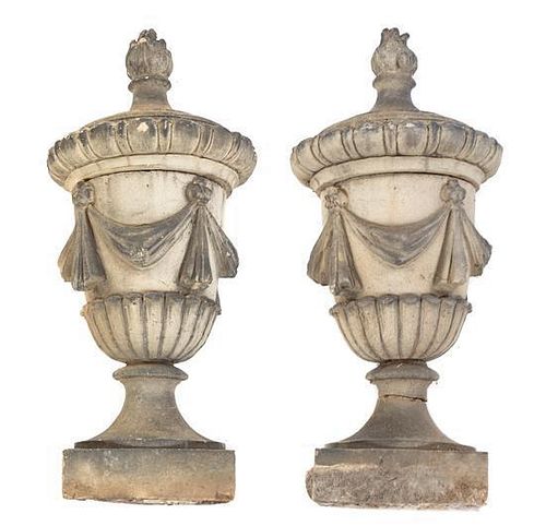 A Pair of Stone Garden Urns Height 31 1/2 inches.