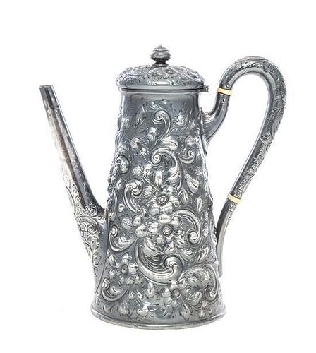An American Silver Coffee Pot, Howard & Co., New York, NY, Circa 1900, worked to show repousse floral decoration and C-scrolls t