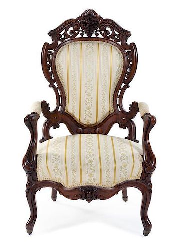 A Rococo Revival Rosewood Armchair Height 44 1/2 inches.