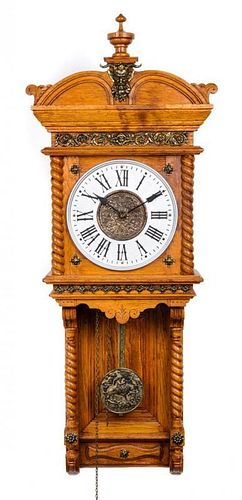 An Ansonia Oak Wall Clock Height 42 1/2 inches.