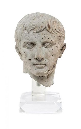 A Stone Bust in the Roman Style Height 13 inches.