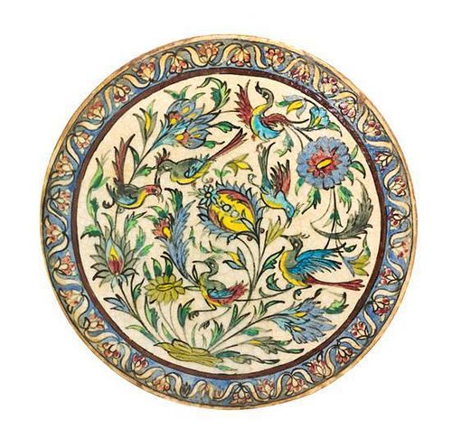 A Circular Persian Pottery Tile Diameter 16 inches.