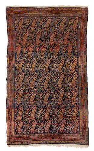 * A Persian Wool Rug 6 feet 5 inches x 4 feet 2 inches.
