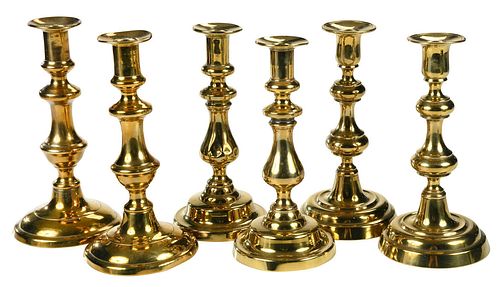 Three Pairs of Georgian Brass Candlesticks