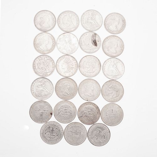 Veintitrés monedas de plata ley .500 y Cuproníquel. Peso: 567.2 g.