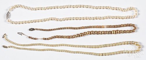 Three pearl necklaces, with 14K gold clasps