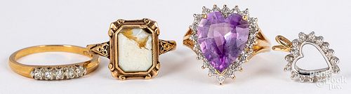 Two 10K gold and gemstone rings and heart pendant