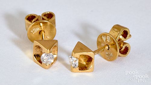 Pair of 18K gold diamond stud earrings
