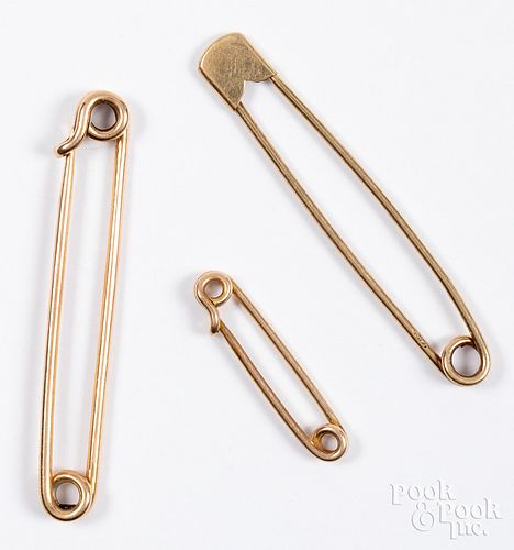Three 14K gold safety pin brooches