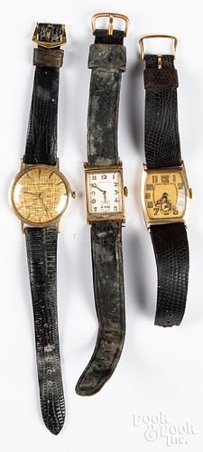 Three 14K gold wristwatches, one with 18K clasp.