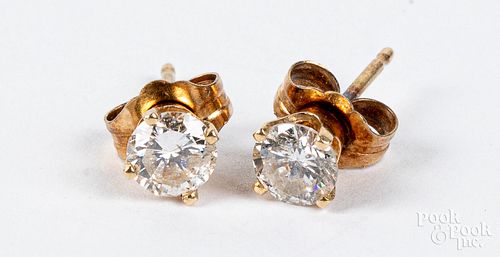 Pair of 14K gold diamond stud earrings
