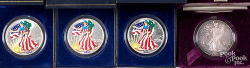 Four American Eagle 1 ozt. fine silver coins.