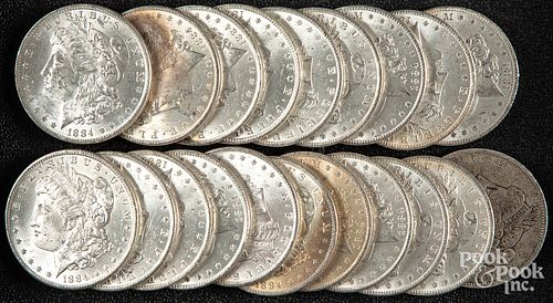 Twenty 1884-O Morgan silver dollars.