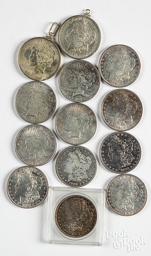 Thirteen silver dollars