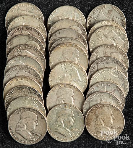 Twenty-eight Franklin silver half dollars.