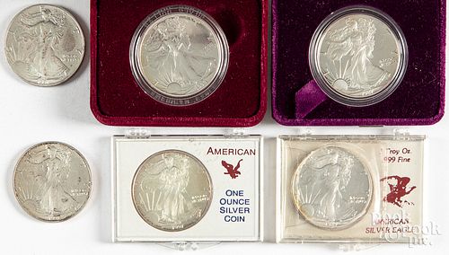 Six 1 ozt. fine silver American eagle coins.