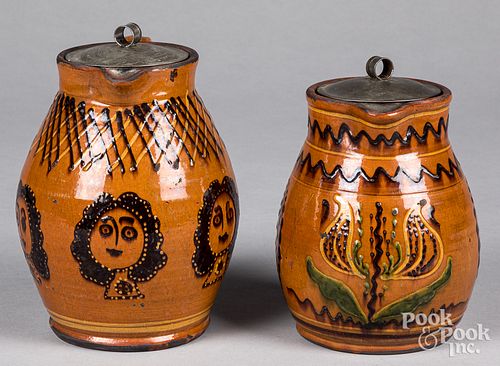 Two Shooner redware pitchers