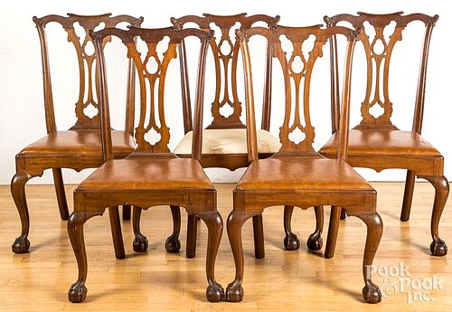 Five Chippendale style mahogany dining chairs.