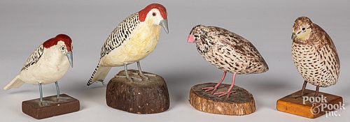 Four carved and painted birds
