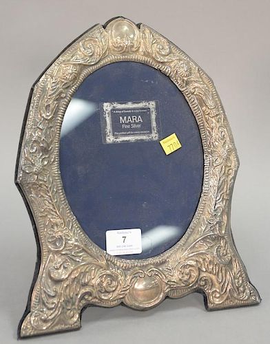 Sterling silver oval frame with stand. ht. 12 in.