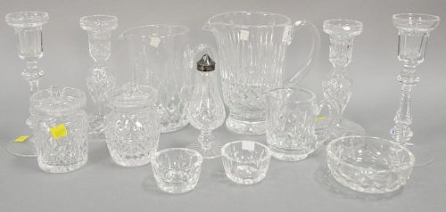 Waterford crystal thirteen piece lot with two pitchers and two pair candlesticks. ht. 1 1/2 in. to 8 in.