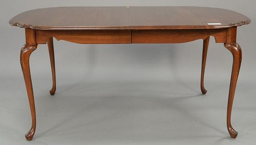 Harden cherry shaped dining table with two 16" leaves and custom pads. closed: 64" x 44", open: 96" x 44"