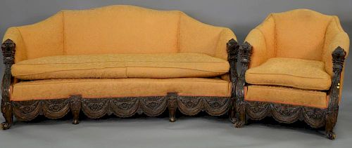 Two piece carved walnut parlor set. sofa: lg. 71 in.