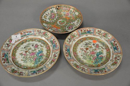 Three Rose Famille plates including pair of plates with birds, wild flowers, and butterflies and a single plate with four painted pa...