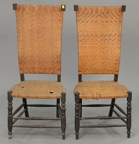 Two caned side chairs.