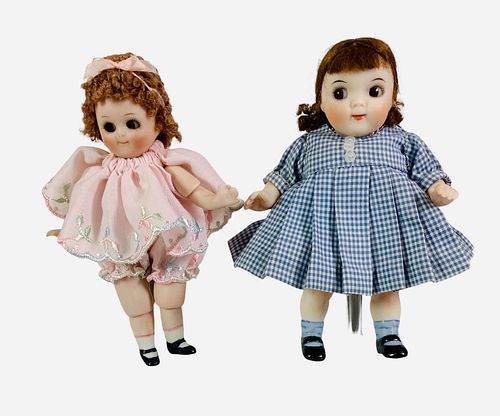 (2) 4 1/2" All Bisque reproduction googly girls. Includes Kestner 111 with jointed elbows and knees. Both have mohair wigs, glass side-glancing eyes, 
