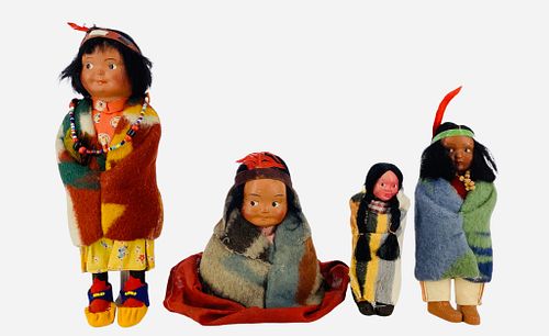 Lot of 4 Native American Skookum dolls, tallest approx 9". One doll is in a permanent sitting position and retains the original manufacturerÃ­s label.
