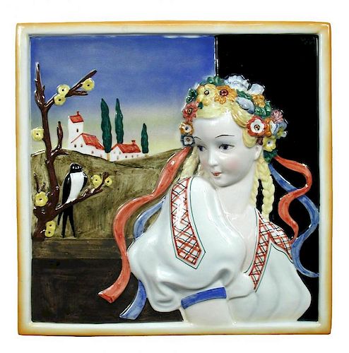 Attributed to Lenci, a porcelain plaque, decorated in relief with a maiden, a church behind and a bi