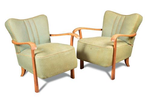 A pair of Art Deco open armchairs, the shaped backs and over stuffed seats in pale green fabric upho