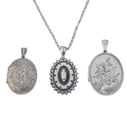 Three late Victorian oval silver lockets and a later chain. To include one engraved to depict a bird