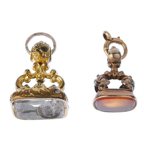 Two late 19th century fob seals. The first with a reverse intaglio depicting a crest, the oval-shape