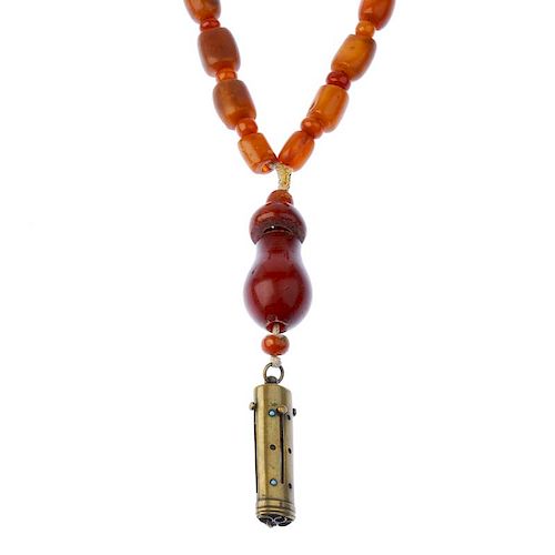 A natural amber necklace. Designed as thirty-eight natural amber beads or barrel and bouton shapes a
