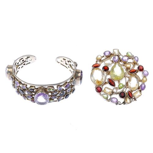 A gem-set bangle and pendant. The bangle with collet-set amethyst, peridot, smoky quartz and garnet