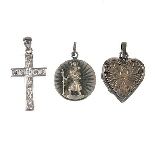 A selection of silver and white metal jewellery. To include a silver locket, the front with engravin