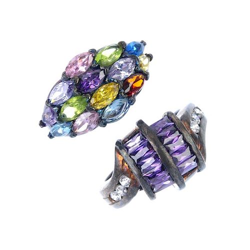 A selection of rings. To include a silver ring designed as a buckled belt, together with a marcasite