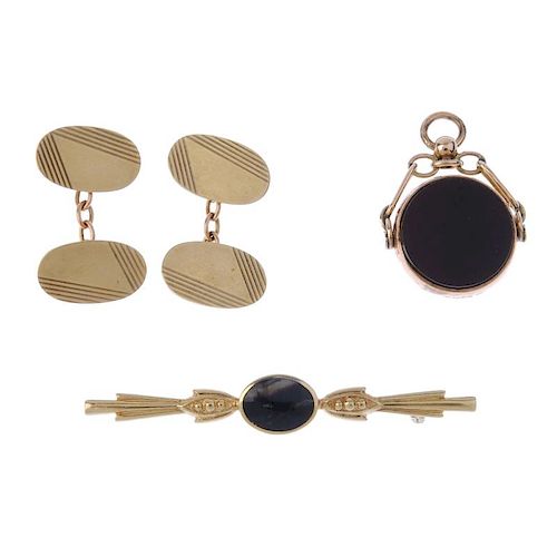 A selection of gold jewellery. To include a bar brooch, the central oval-shape cabochon Blue John to